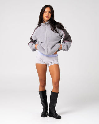 Woman wearing Coach Zip Through Sherpa Fleece in Ultimate Grey
