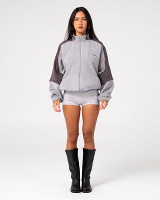 Woman wearing Coach Zip Through Sherpa Fleece in Ultimate Grey