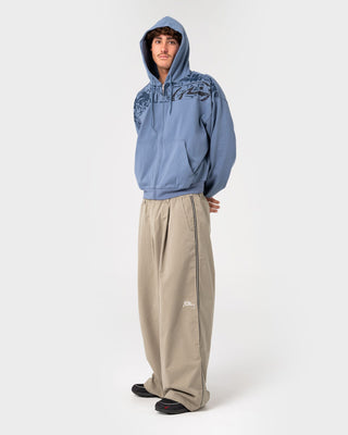Man wearing Chief Keef Lightweight Zip-thru Hoodie in Shadow Blue