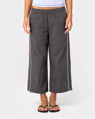 Woman wearing Played Low Rise Capri Track Pant in Carbon