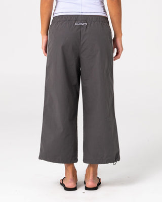 Woman wearing Played Low Rise Capri Track Pant in Carbon