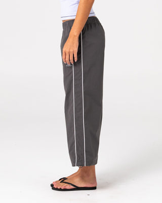 Woman wearing Played Low Rise Capri Track Pant in Carbon