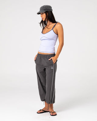 Woman wearing Played Low Rise Capri Track Pant in Carbon