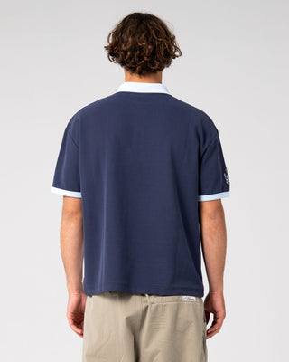 Man wearing Prestige Short Sleeve Polo in Navy Blue
