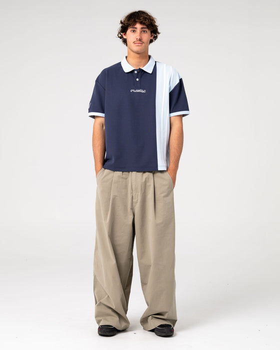 man-wearing-prestige-short-sleeve-polo-in-navy-blue
