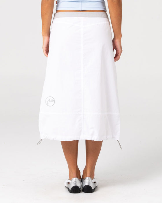 woman-wearing-player-low-rise-midi-skirt-in-white