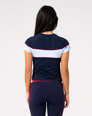 Woman wearing Kinetic Baby Tee in Navy Blue