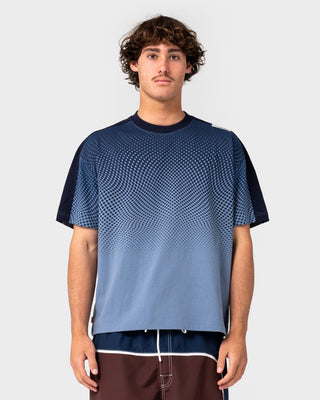 Man wearing Shadowfax Short Sleeve Tee in Shadow Blue