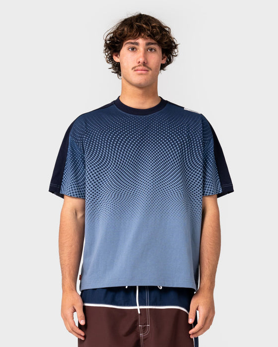 man-wearing-shadowfax-short-sleeve-tee-in-shadow-blue