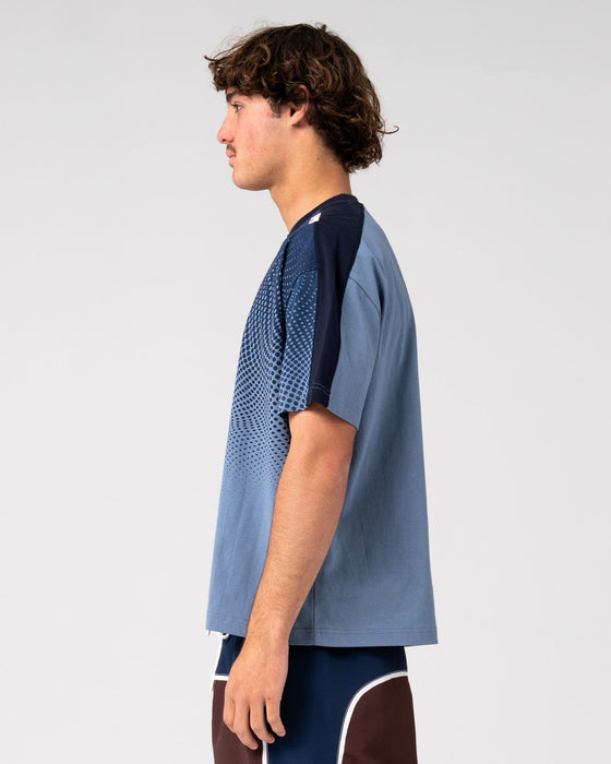 man-wearing-shadowfax-short-sleeve-tee-in-shadow-blue