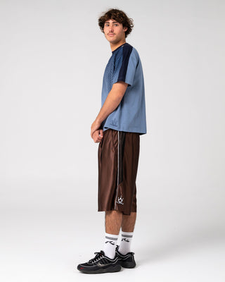 Man wearing Vinsanity Elastic Basketball Short in Brown