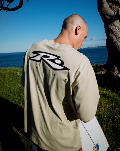 Man wearing Registered Short Sleeve Tee in Brown