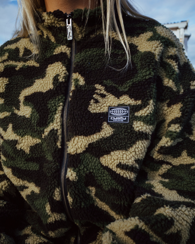 Woman wearing Camo Zip Through Sherpa Fleece in Green