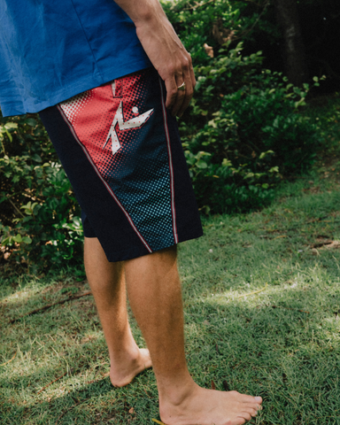 Man wearing V8 Printed Elastic Boardshort in Navy Blue