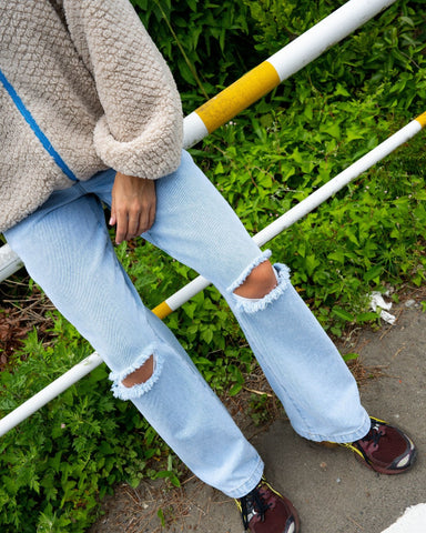 Woman wearing Low Rise Wide Leg Ripped Denim Jean in Sky Blue Heather