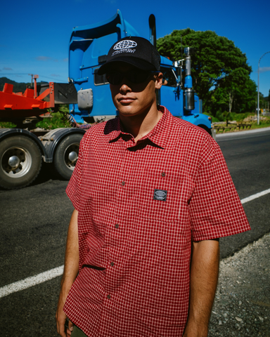 Man wearing Worldwide Curved Hem Short Sleeve Shirt in Red