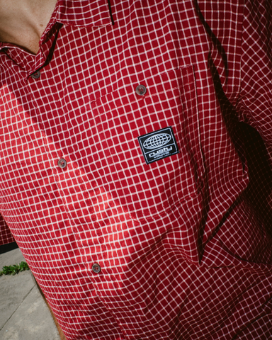 Man wearing Worldwide Curved Hem Short Sleeve Shirt in Red