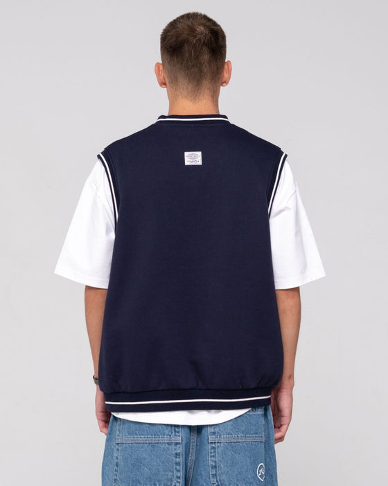 man-wearing-drop-top-v-neck-fleece-vest-in-navy-blue