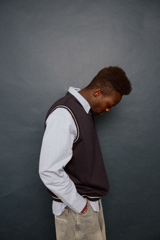 Man wearing Drop Top V Neck Fleece Vest in Navy Blue