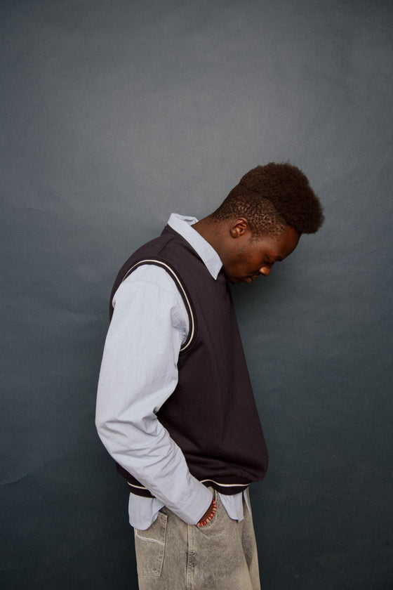 man-wearing-drop-top-v-neck-fleece-vest-in-navy-blue