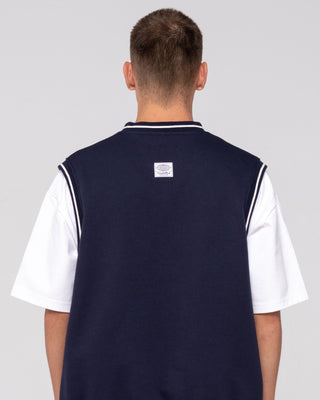 Man wearing Drop Top V Neck Fleece Vest in Navy Blue