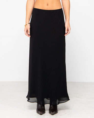 Woman wearing Midnights Low Rise Maxi Skirt in Black