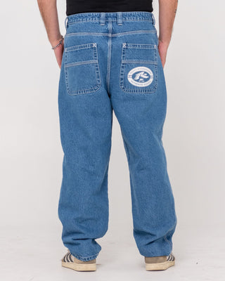 Man wearing Trusty Tapered Rush Hour Denim Jean in Middy Blue