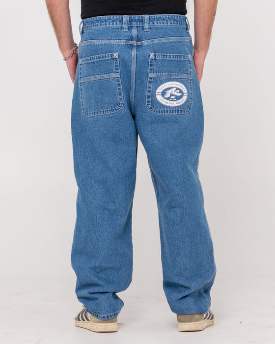 man-wearing-trusty-tapered-rush-hour-denim-jean-in-middy-blue