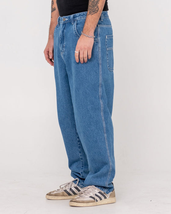 man-wearing-trusty-tapered-rush-hour-denim-jean-in-middy-blue