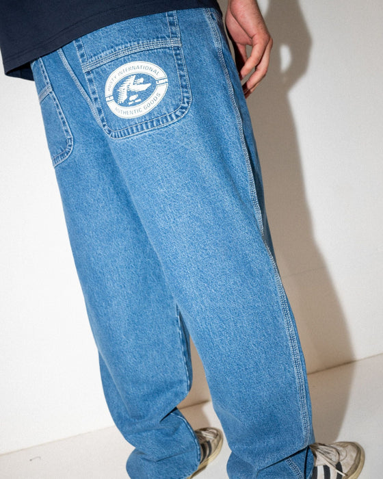 man-wearing-trusty-tapered-rush-hour-denim-jean-in-middy-blue