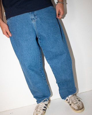 Man wearing Trusty Tapered Rush Hour Denim Jean in Middy Blue