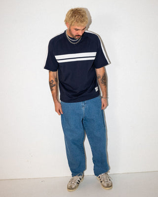 Man wearing Trusty Tapered Rush Hour Denim Jean in Middy Blue