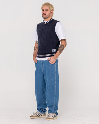 Man wearing Trusty Tapered Rush Hour Denim Jean in Middy Blue