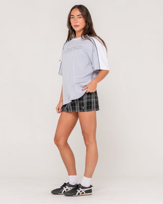 Woman wearing Plaidnani Low Rise Mini Skirt in Carbon Plaid