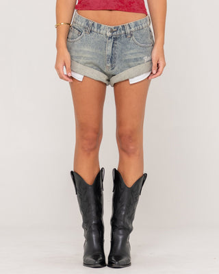 Woman wearing X-tina Pheonix Low Rise Denim Mini Short in Dirty Dawg