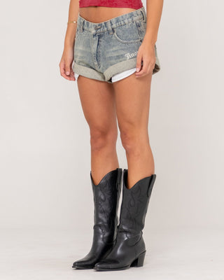 Woman wearing X-tina Pheonix Low Rise Denim Mini Short in Dirty Dawg
