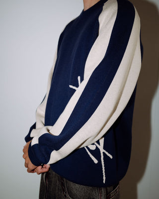 Man wearing Roll Safe Boxy Knitted Crew in Dark Blue