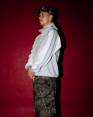 Man wearing Paneka Hooded Fleece in Grey Marle