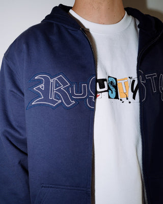 Man wearing Ransom Zip Thru Hooded Fleece in Dark Blue