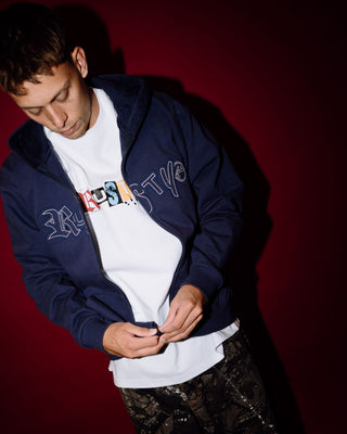 Man wearing Ransom Zip Thru Hooded Fleece in Dark Blue