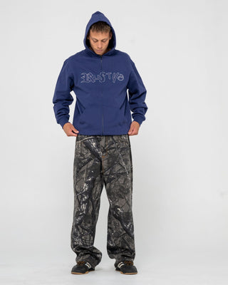 Man wearing Ransom Zip Thru Hooded Fleece in Dark Blue