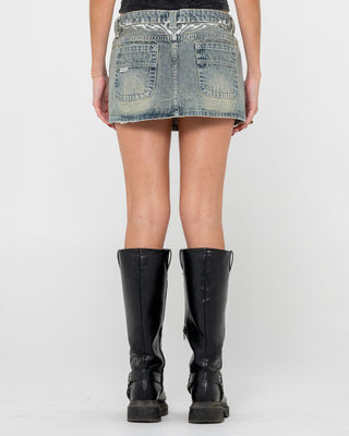 Woman wearing Morty Low Rise Denim Micro Mini Skirt in Dirty Dawg