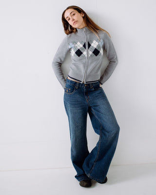 Woman wearing Clued In Zip Through Knit in Grey Marle