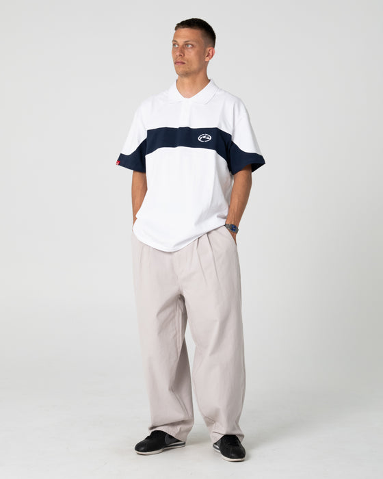 man-wearing-enigma-pleated-pant-in-stone