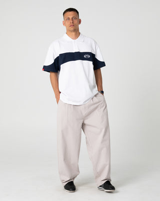 Man wearing Enigma Pleated Pant in Stone