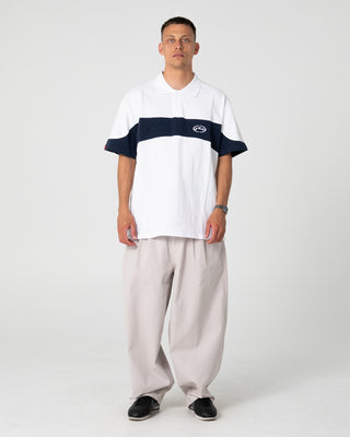 Man wearing Enigma Pleated Pant in Stone