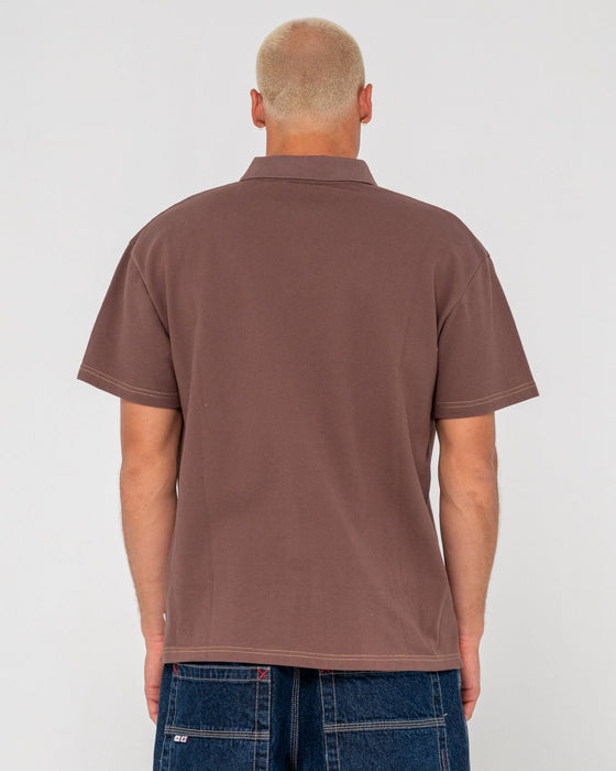 man-wearing-blinker-short-sleeve-polo-in-pinecone