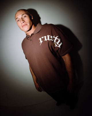 Man wearing Blinker Short Sleeve Polo in Pinecone