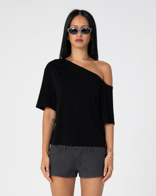 Woman wearing Sally Slouch Off Shoulder Tee in Black