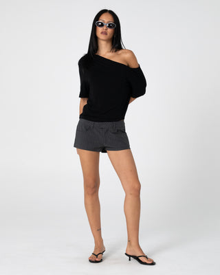 Woman wearing Sally Slouch Off Shoulder Tee in Black